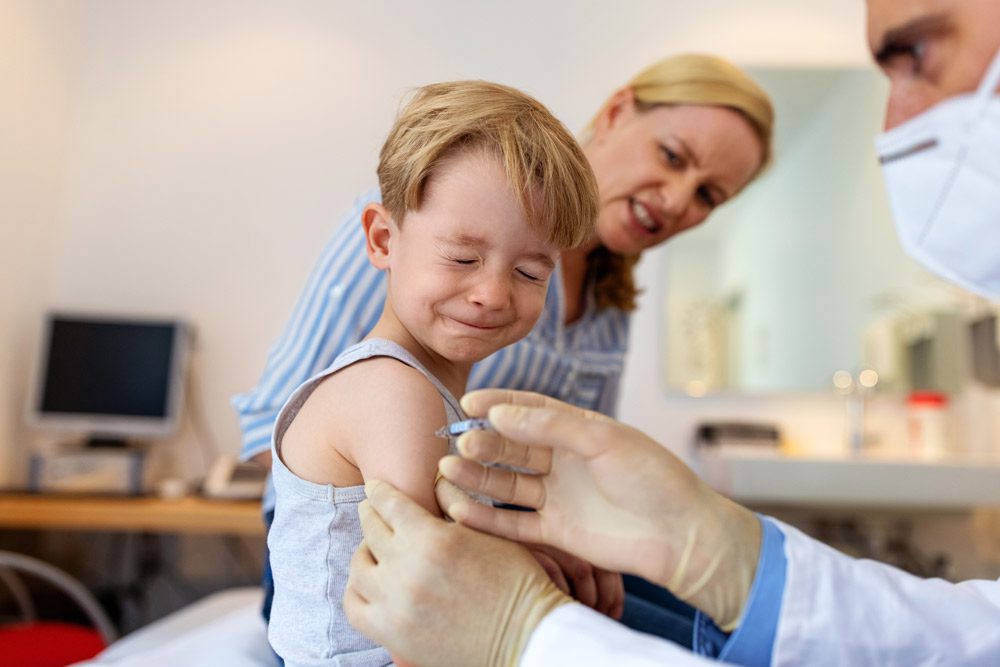 Little boy getting a shot