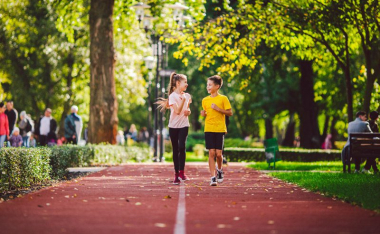 Boy and girl on rubberized walking path