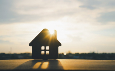 Wooden House with sun flare.