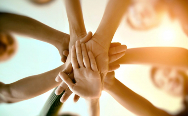 group holding hands.